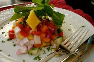 A vegetable and fruit salad with fork