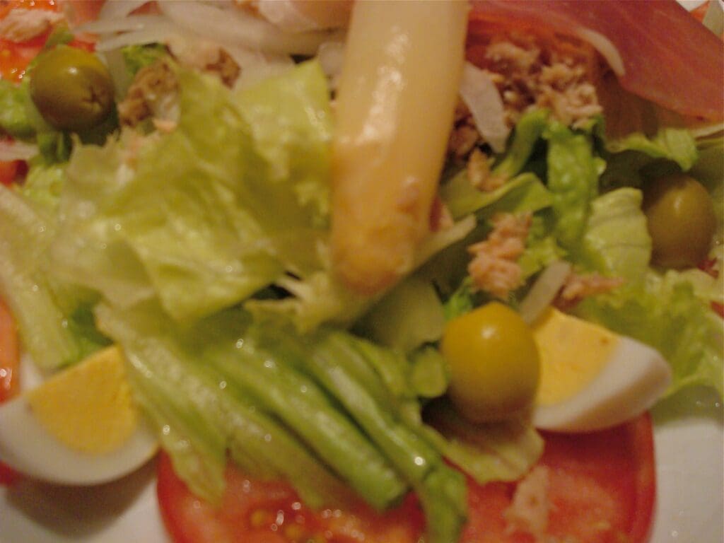 A salad on a white plate.