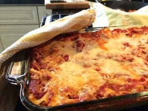 A lasagna recipe on the stove.