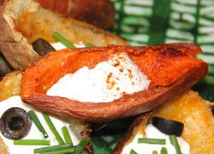 Stuffed sweet potatoes with sour cream and green olives.