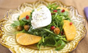 Persimmon and burratta salad with pomegranates and goat cheese.