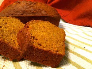 Two slices of delicious pumpkin bread on a towel.