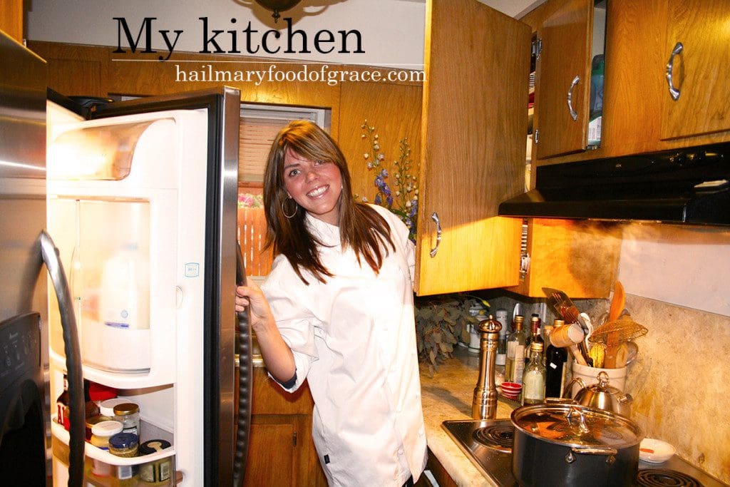 A woman standing in a kitchen.