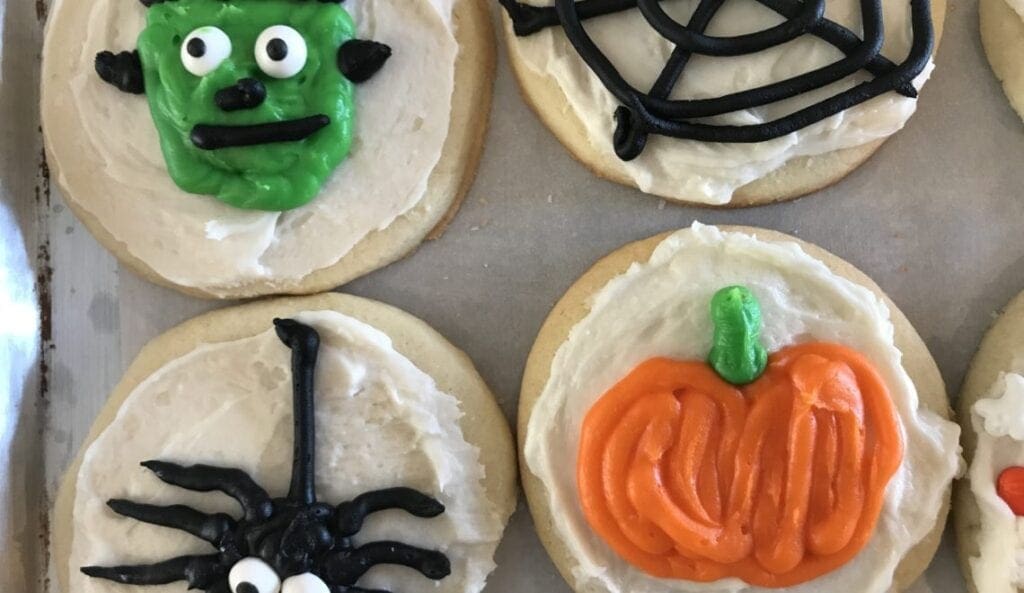 Halloween cookies decorated with icing and decorations.