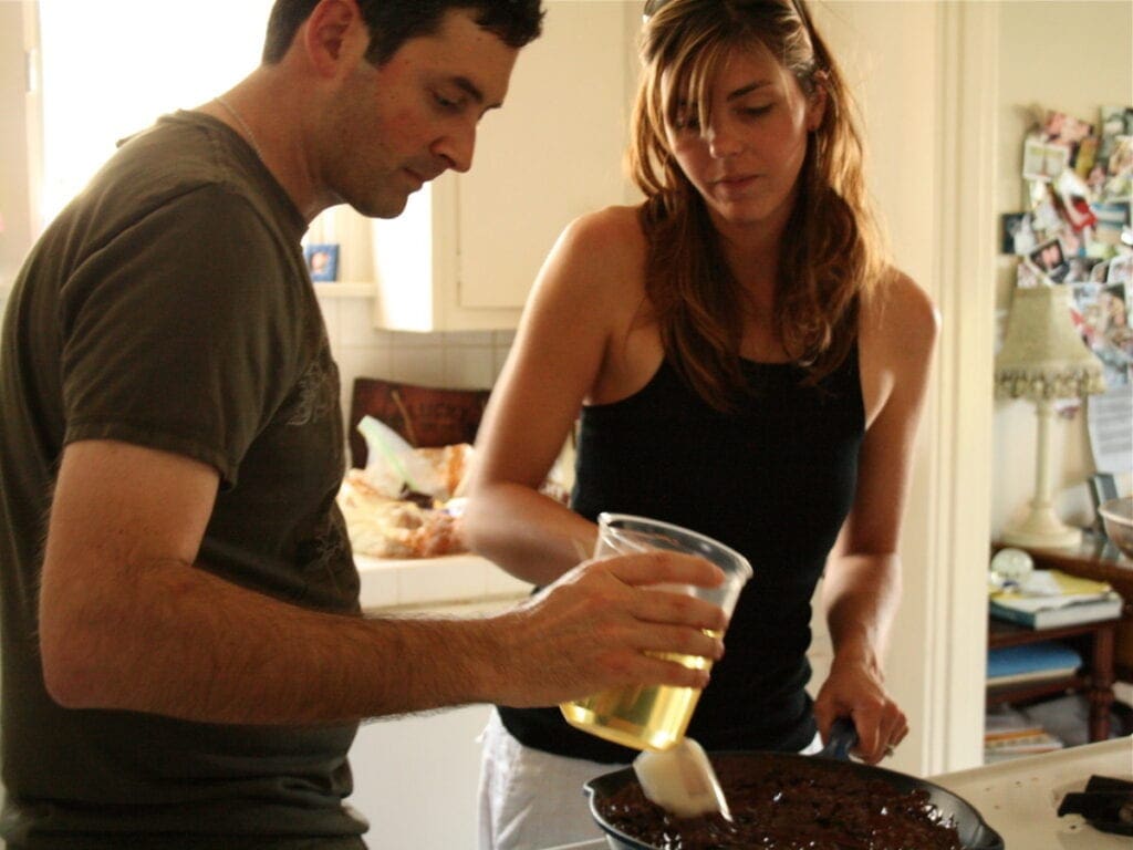 a woman and a man baking together