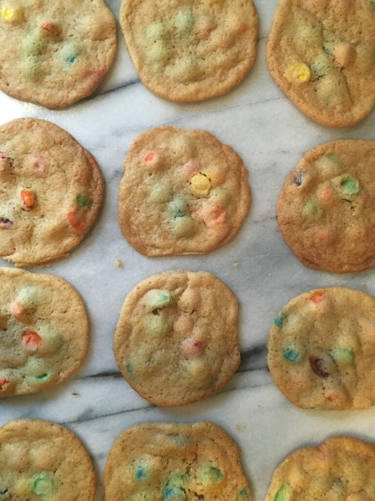 M&m cookies on a marble countertop.