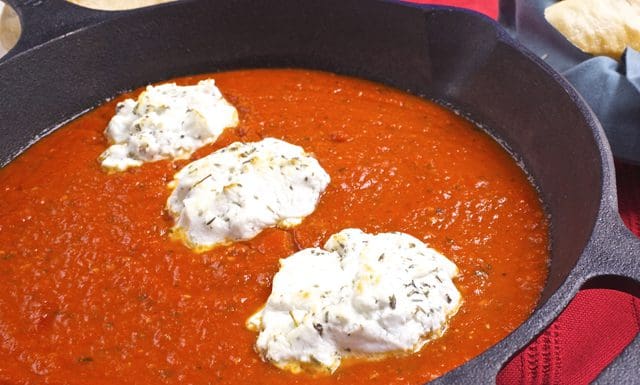 Goat cheese and tomato sauce in a pan