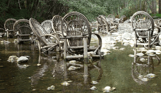 Chairs in a river.