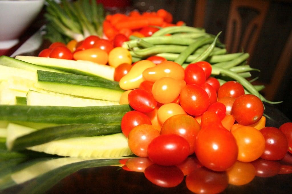 A tray of vegetables on a table.