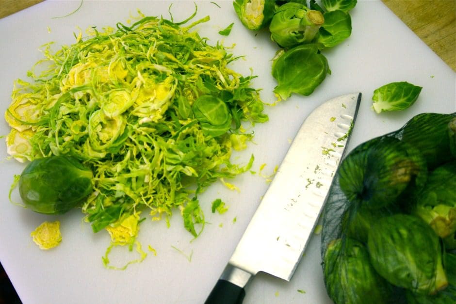 Brussel sprouts on a cutting board.