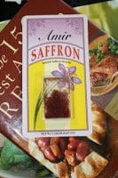 A book with saffron on top of it.