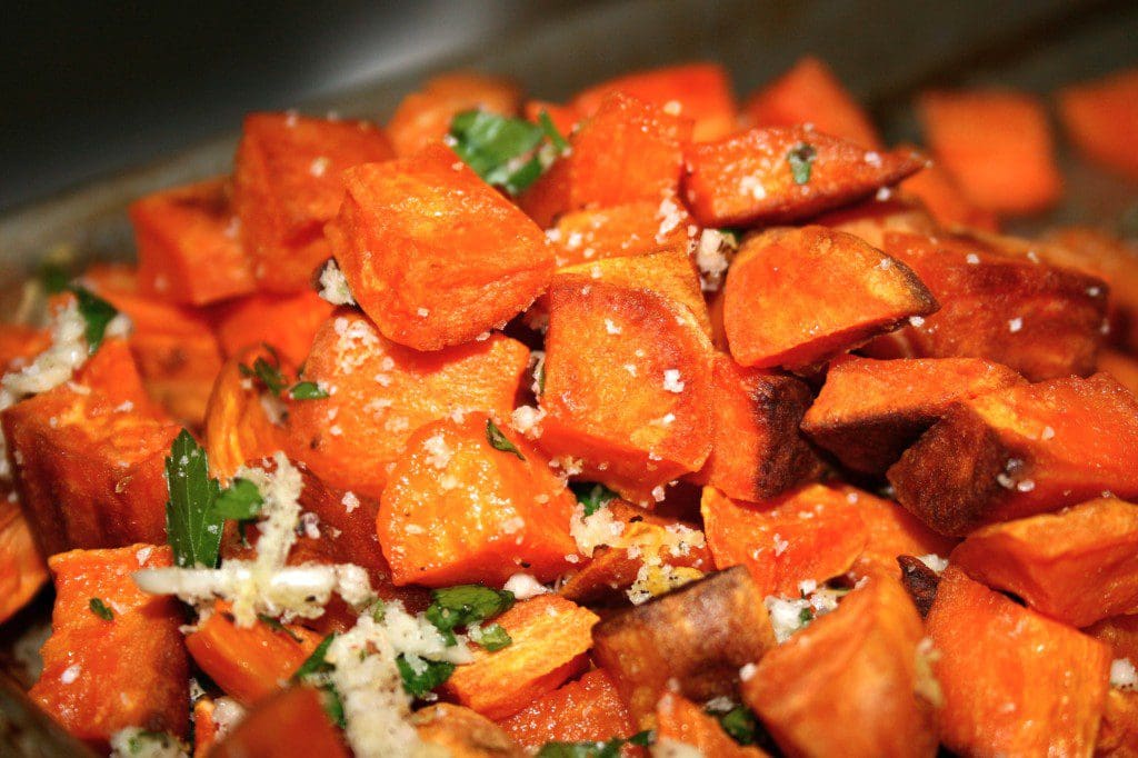 Roasted sweet potatoes with parsley.