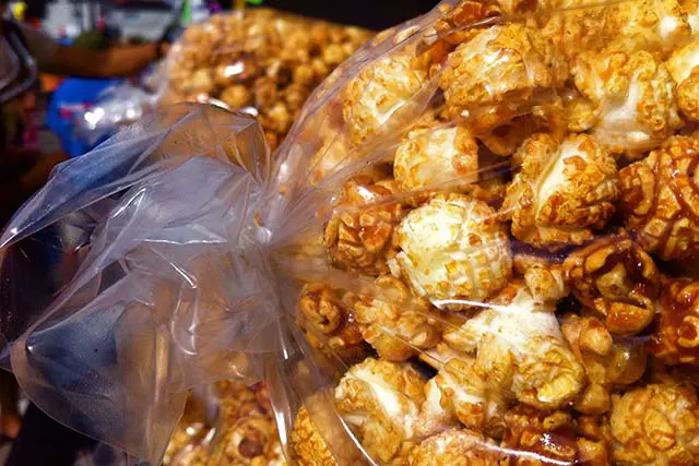 A bag of popcorn sitting on a table.