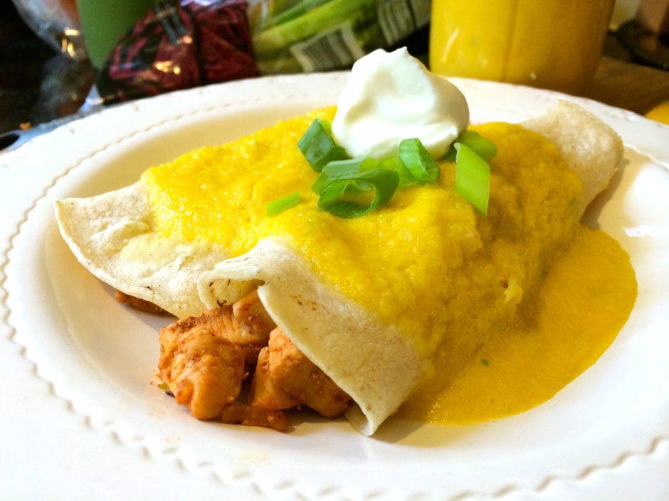 Chicken quesadilla with sour cream and scallions.