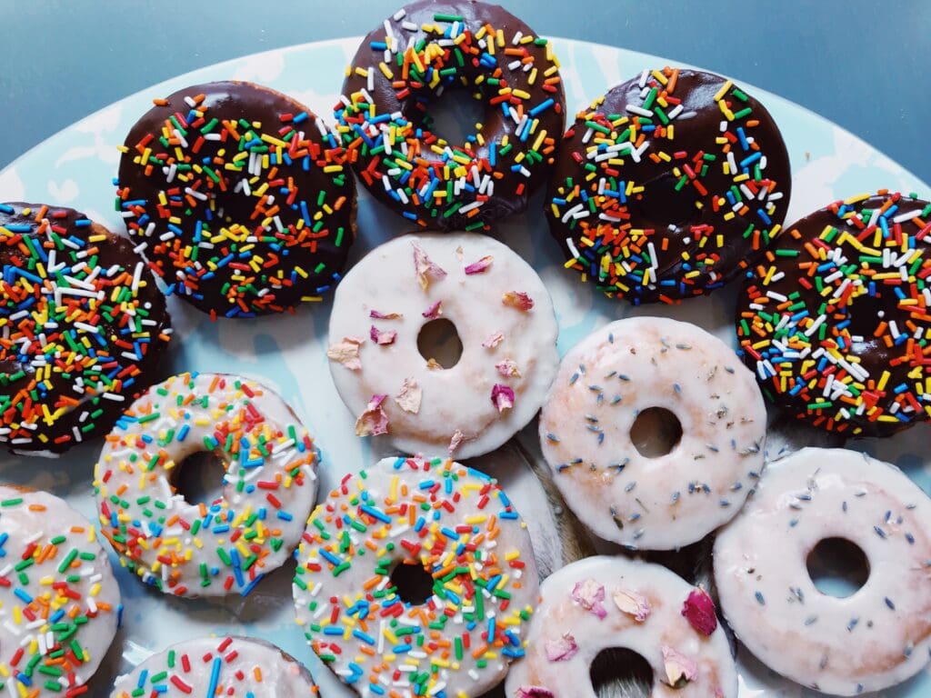 a plate of donuts with different flavors