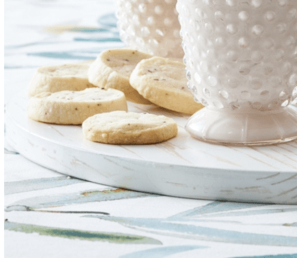 A tray with cookies and a glass of milk.