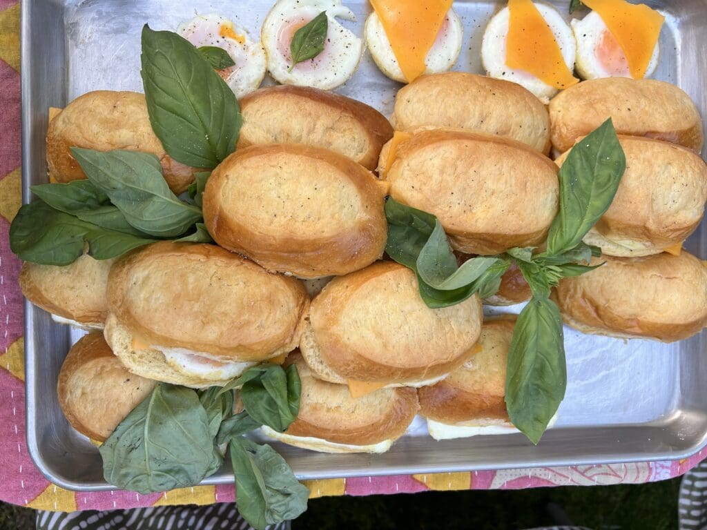 Multiple egg sandwiches on a grey tray