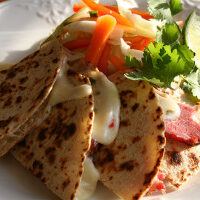 Try this delicious corned beef quesadilla recipe with a variety of vegetables on a plate.