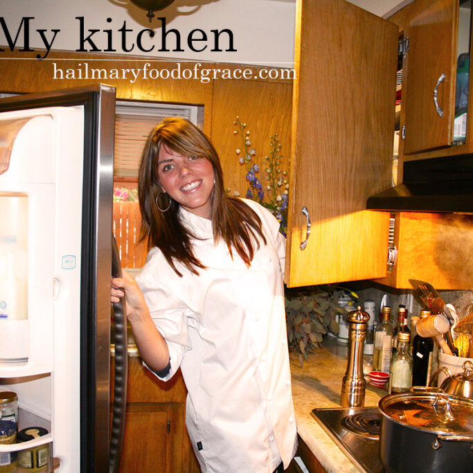 A woman standing in a kitchen.