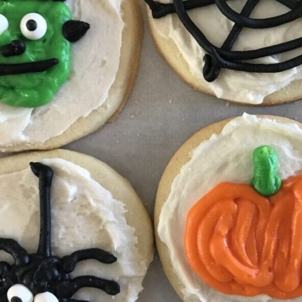 Halloween cookies decorated with icing and decorations.