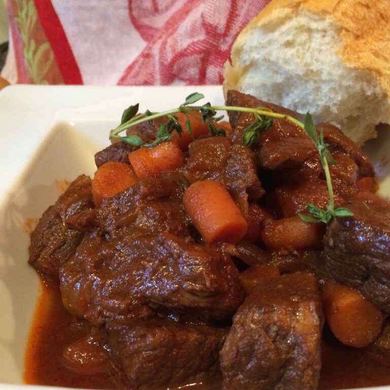 A bowl of meat and vegetables.