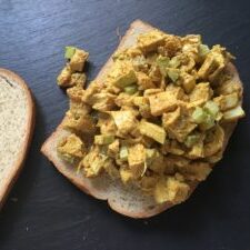 A piece of bread with food on it.