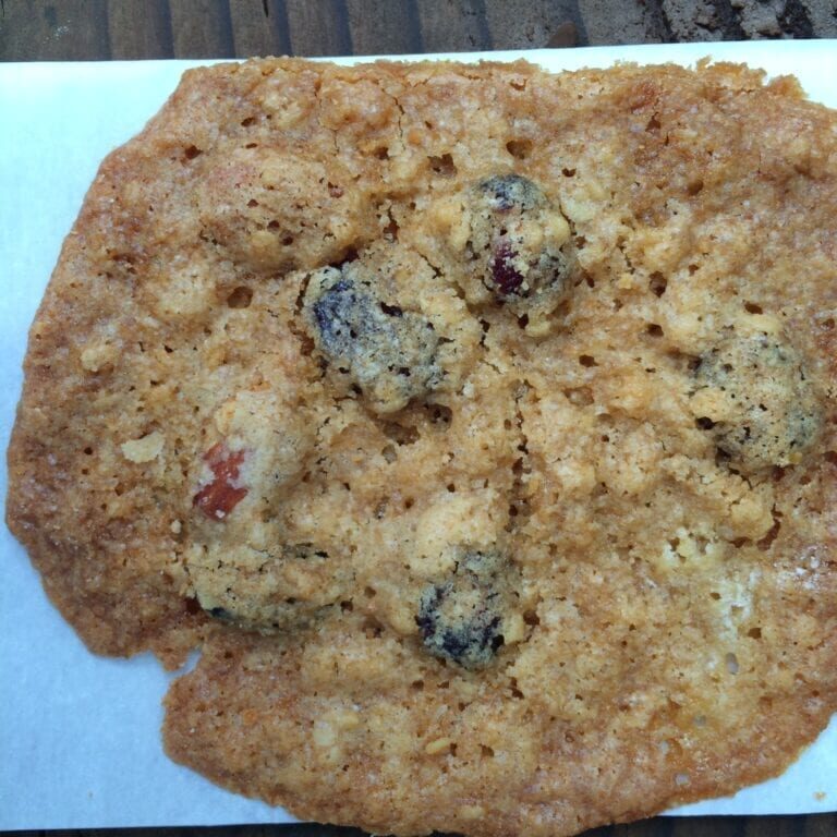 A lace cookie on a piece of paper.