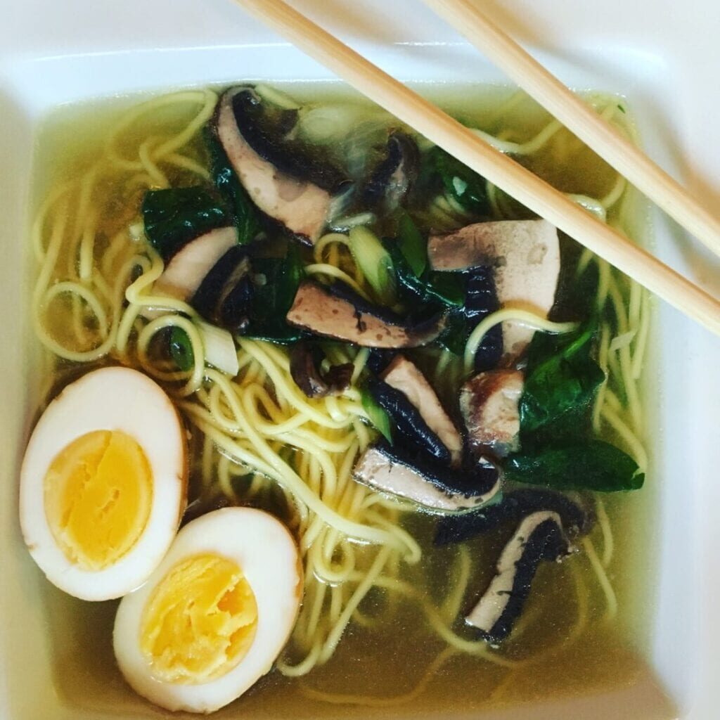 a bowl of Ramen Soup and chopsticks