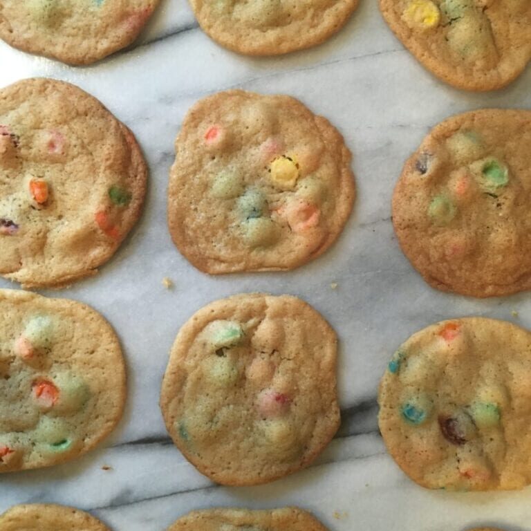 M&m cookies on a marble countertop.