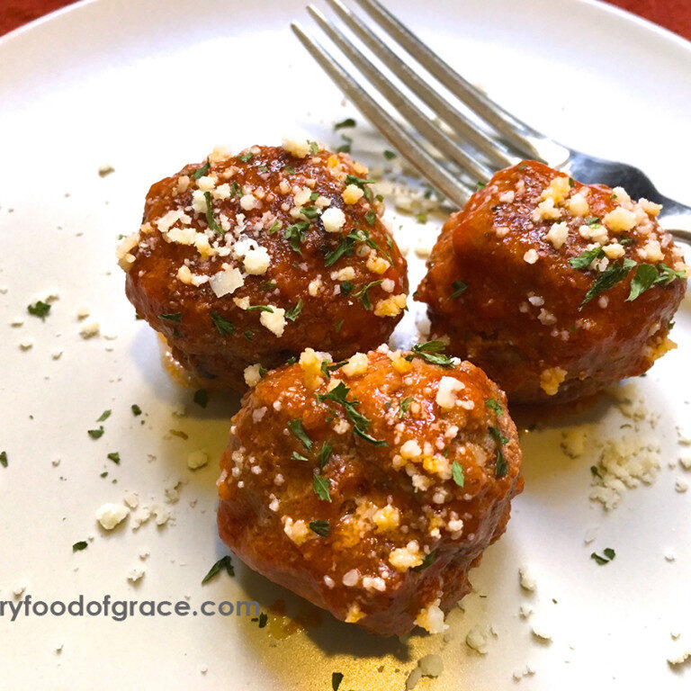 three Traditional Meatballs on plate with a fork
