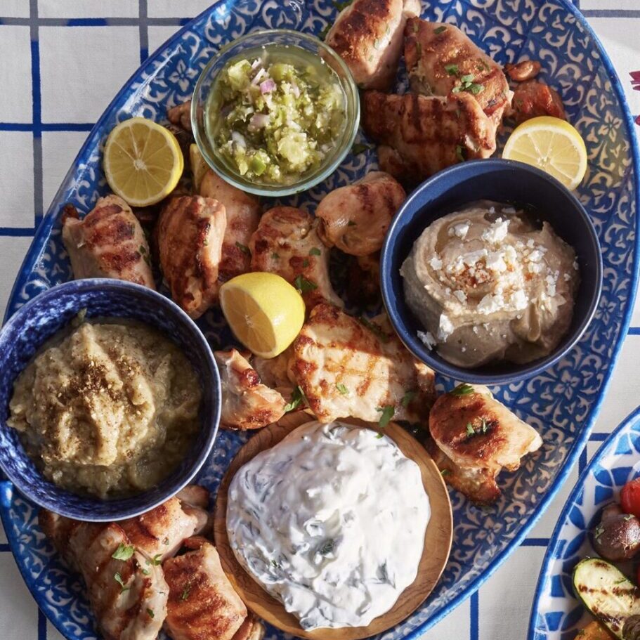 Grilled marinated chicken thighs and Mediterranean toppings