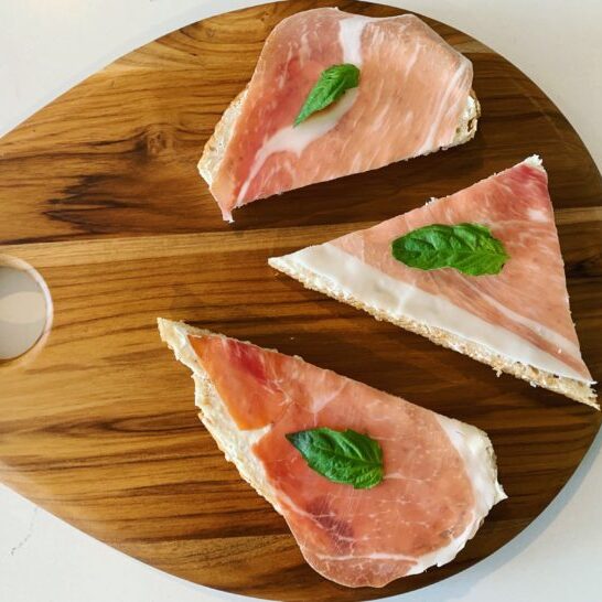 Whole grain bread with prosciutto and crème fraiche